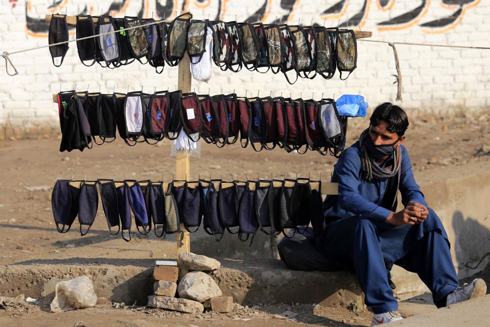 A man sells protective face masks